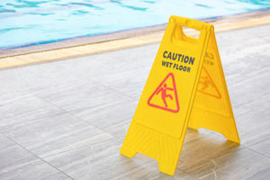 Caution Wet Floor Sign by Pool